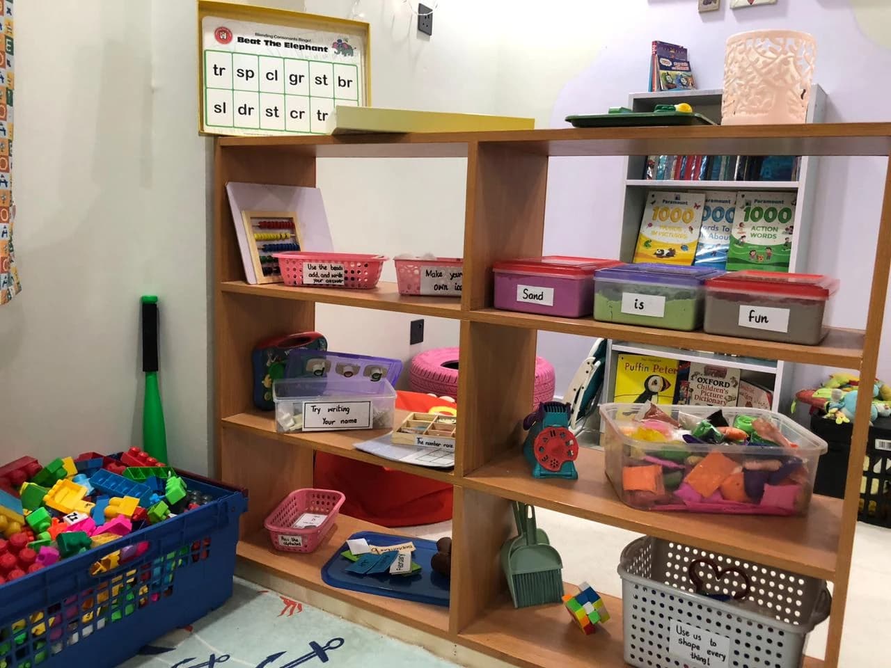 A classroom shelf with learning materials