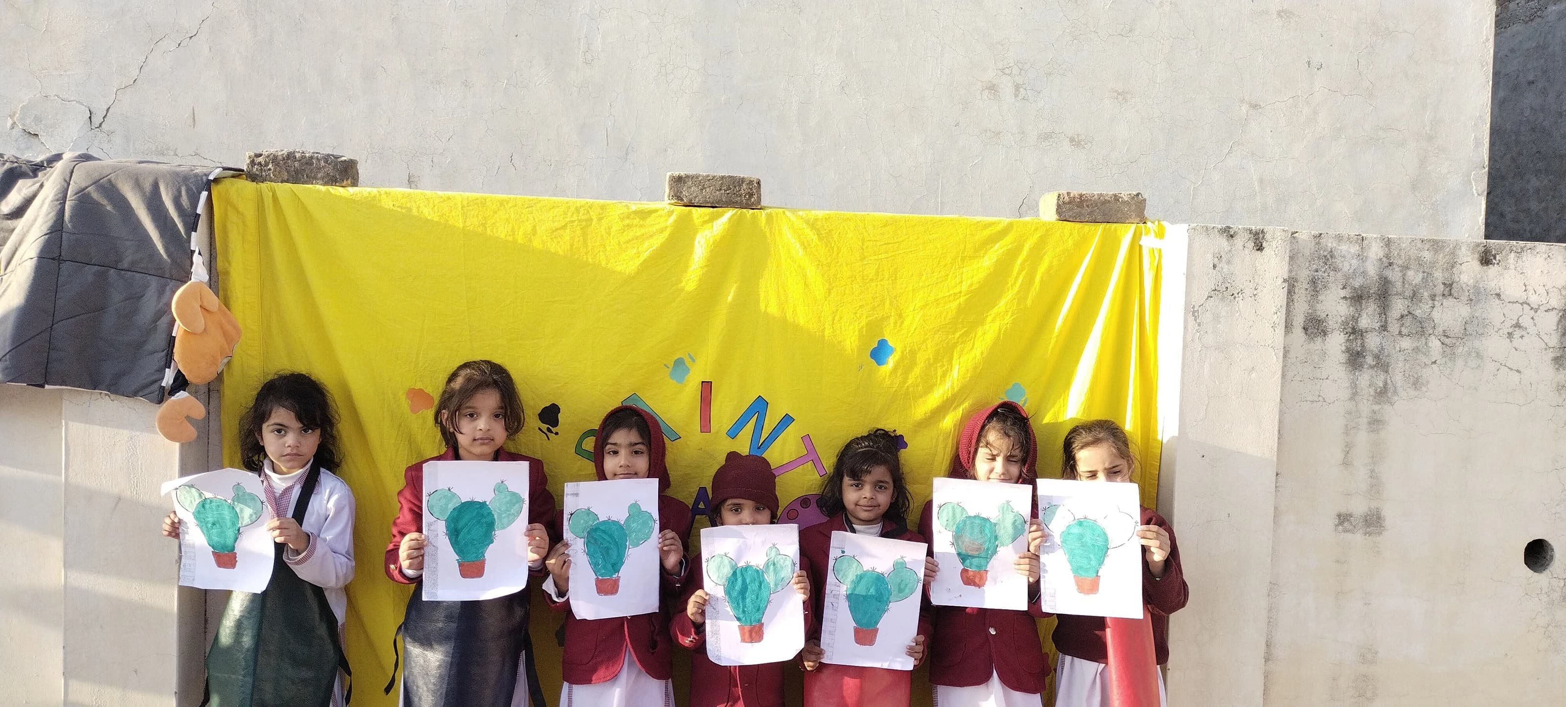 Young artists sharing their work outside