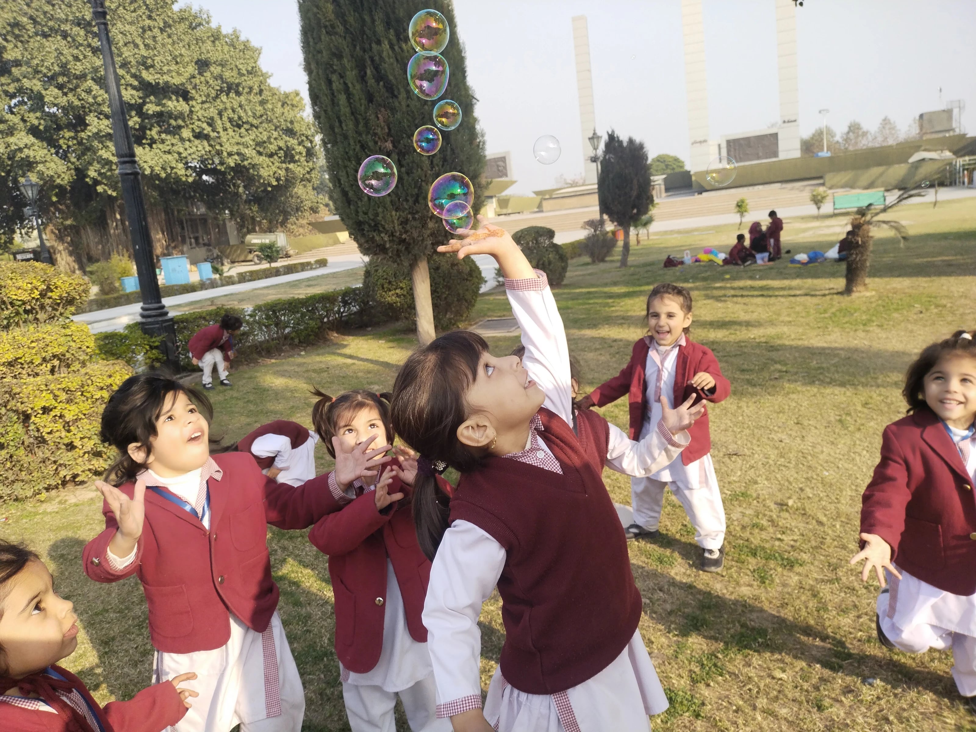 AMS children playing together outdoors