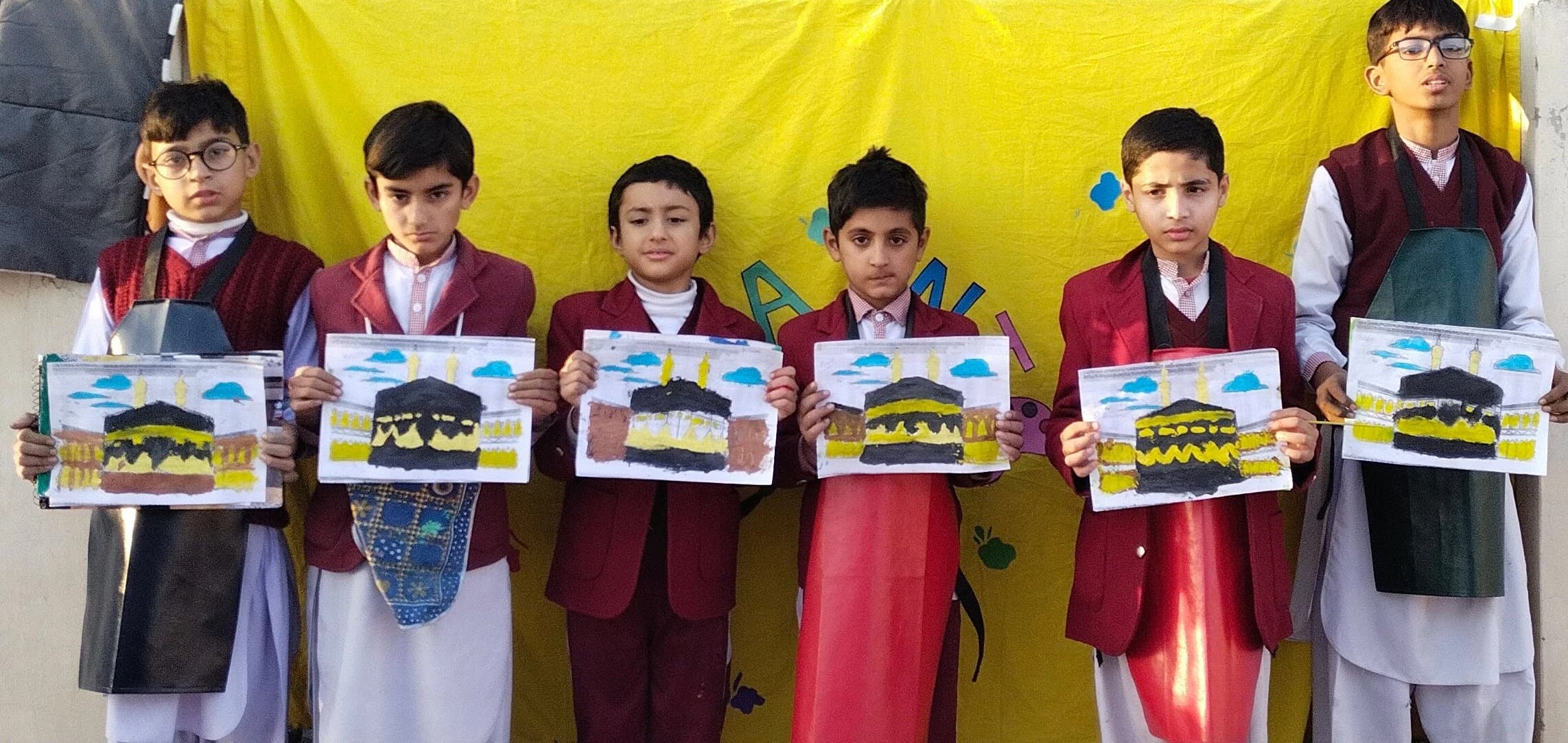 Children presenting their colorful drawings